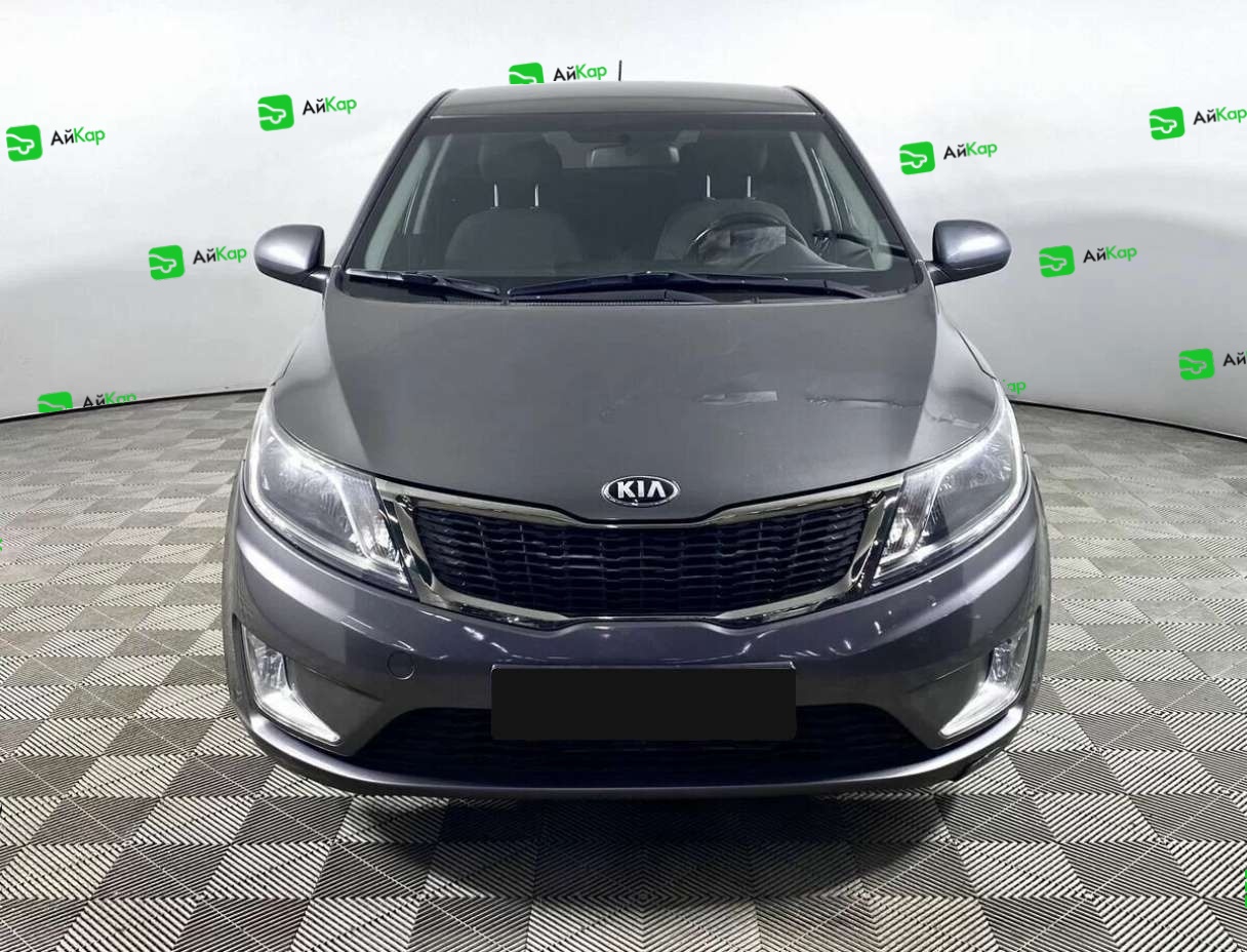 Kia Rio с пробегом — 2013 год. Фото: #1