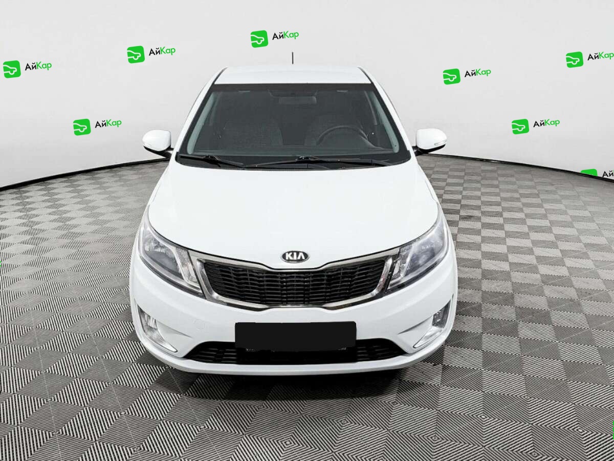 Kia Rio с пробегом — 2013 год. Фото: #1