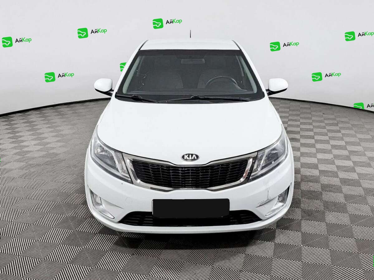 Kia Rio с пробегом — 2013 год. Фото: #1