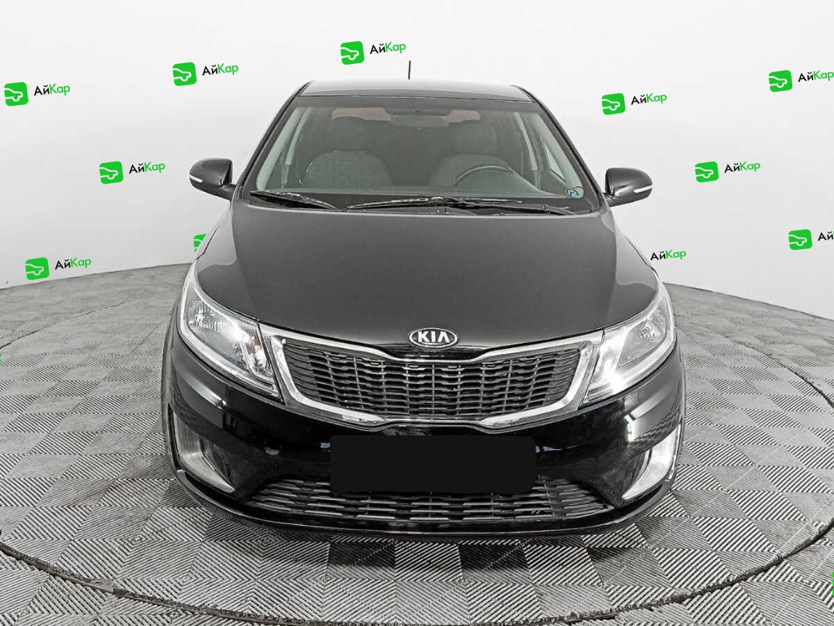Kia Rio с пробегом — 2015 год. Фото: #1