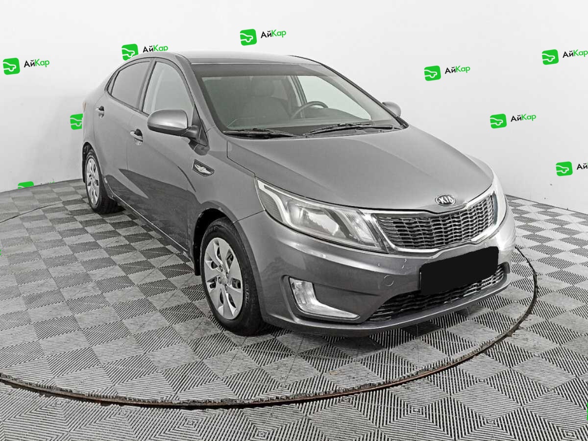Kia Rio с пробегом — 2013 год. Фото: #1