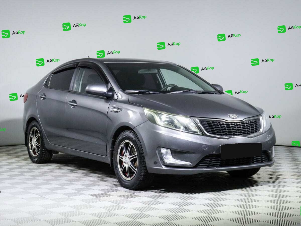 Kia Rio с пробегом — 2013 год. Фото: #2